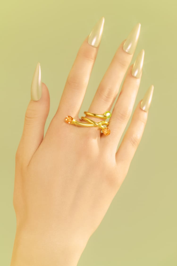 Anello asimmetrico in oro con opale e cristalli di topazio
